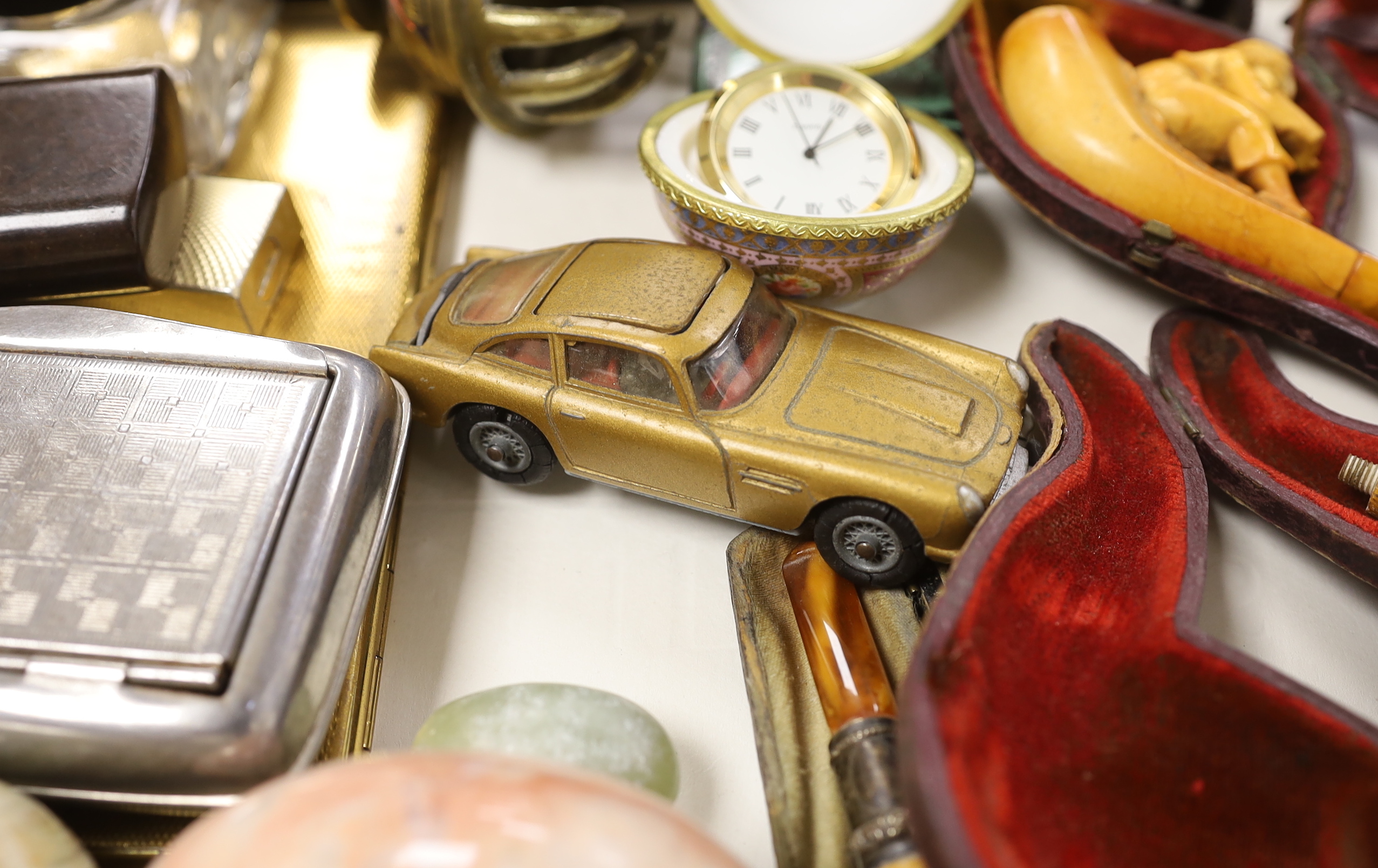 A group of mixed collectables including a Corgi James Bond Aston Martin DB, smoking pipes etc.